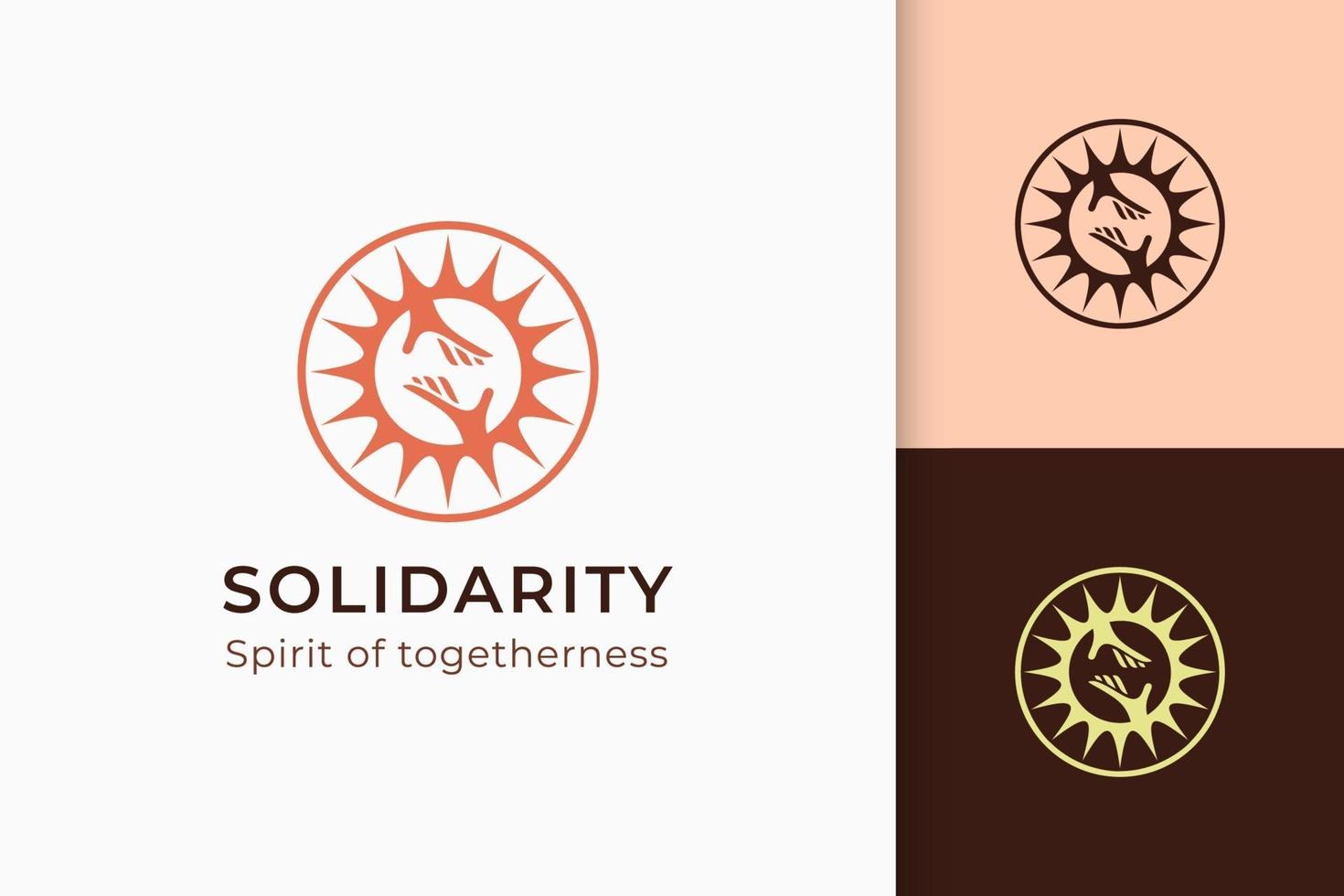 le logo de charité ou de don à la main et le soleil représentent la paix ou la solidarité vecteur