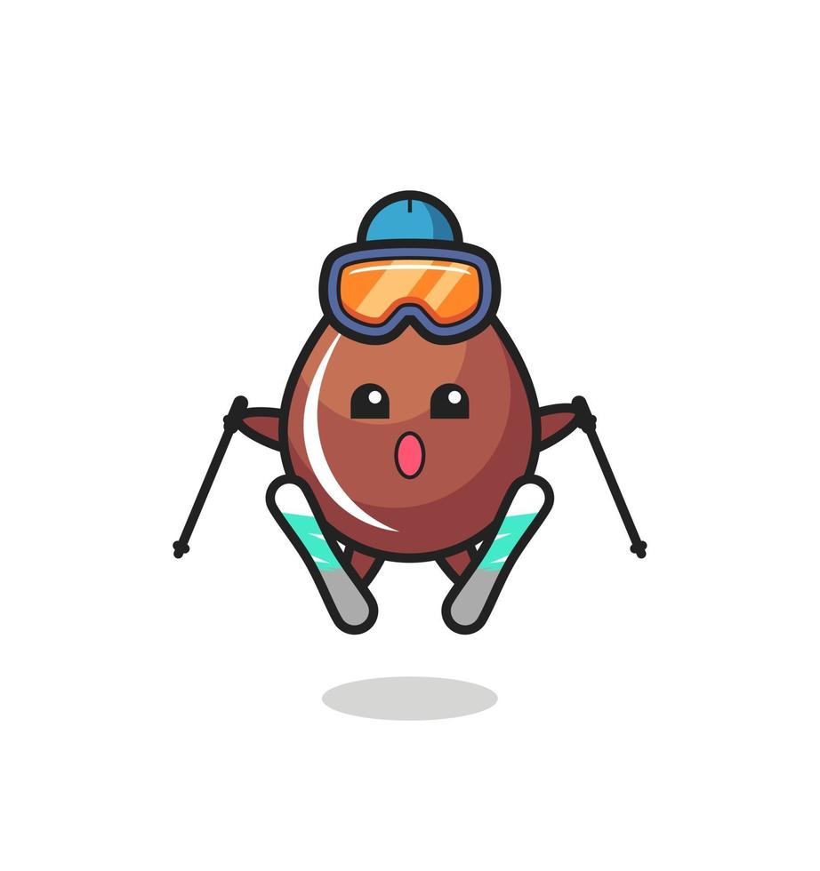 personnage mascotte goutte de chocolat en tant que joueur de ski vecteur