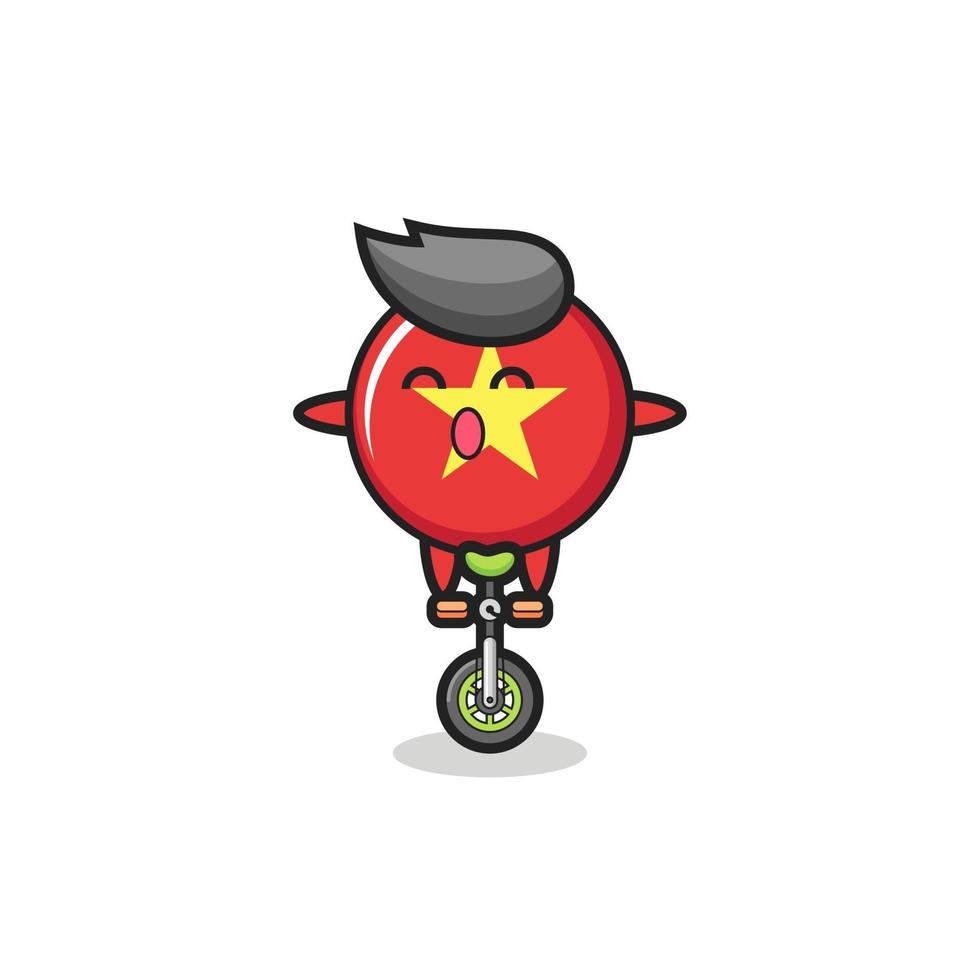 le mignon personnage insigne du drapeau vietnamien fait du vélo de cirque vecteur