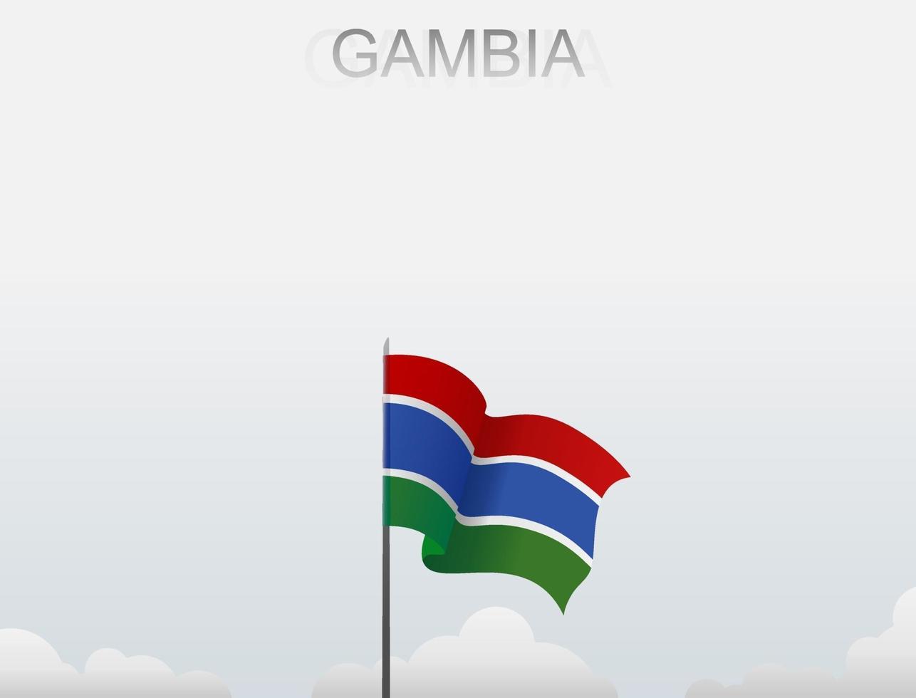 le drapeau gambien flotte sur un poteau qui se dresse sous le ciel blanc vecteur