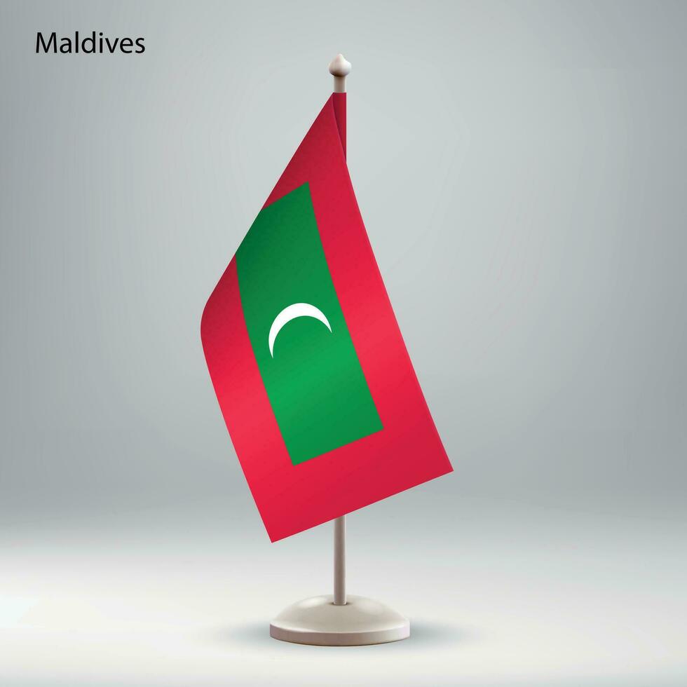 drapeau de Maldives pendaison sur une drapeau rester. vecteur