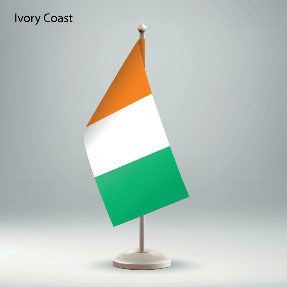 drapeau de Ivoire côte pendaison sur une drapeau rester. vecteur