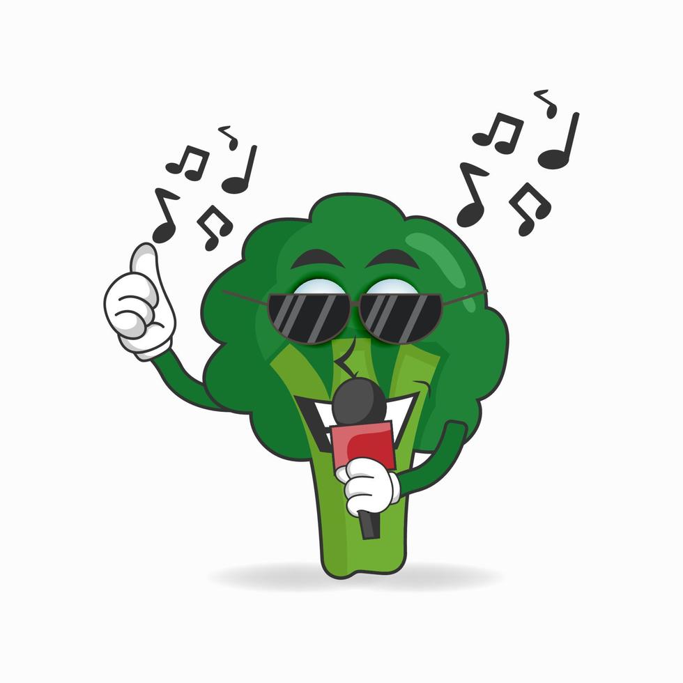le personnage mascotte du brocoli chante. illustration vectorielle vecteur