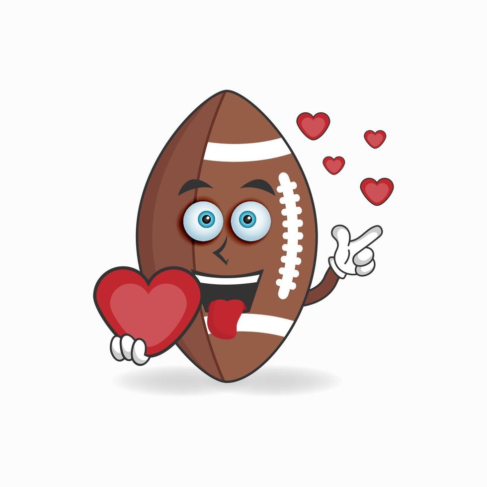 personnage de mascotte de football américain tenant une icône d'amour. illustration vectorielle vecteur