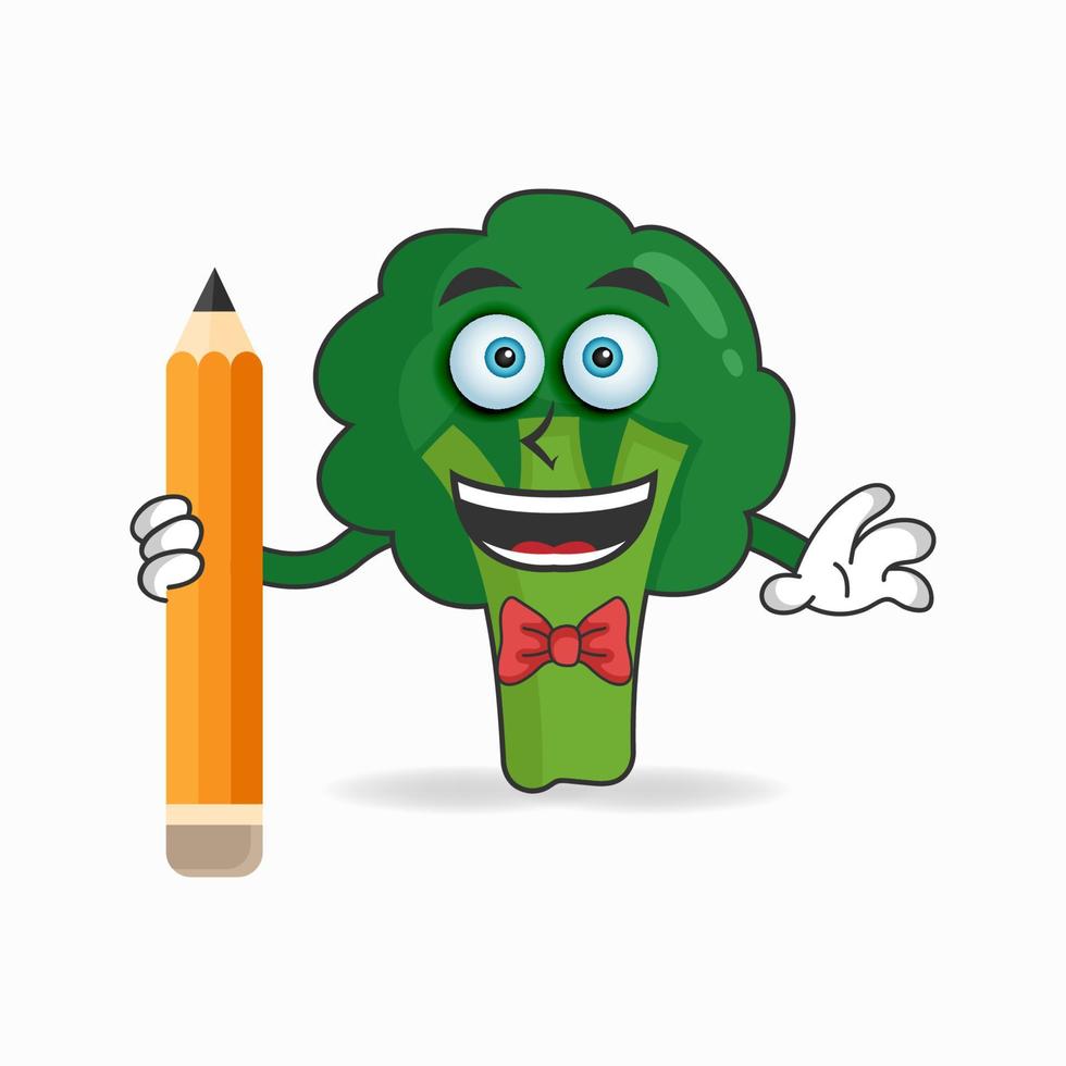 personnage de mascotte de brocoli tenant un crayon. illustration vectorielle vecteur