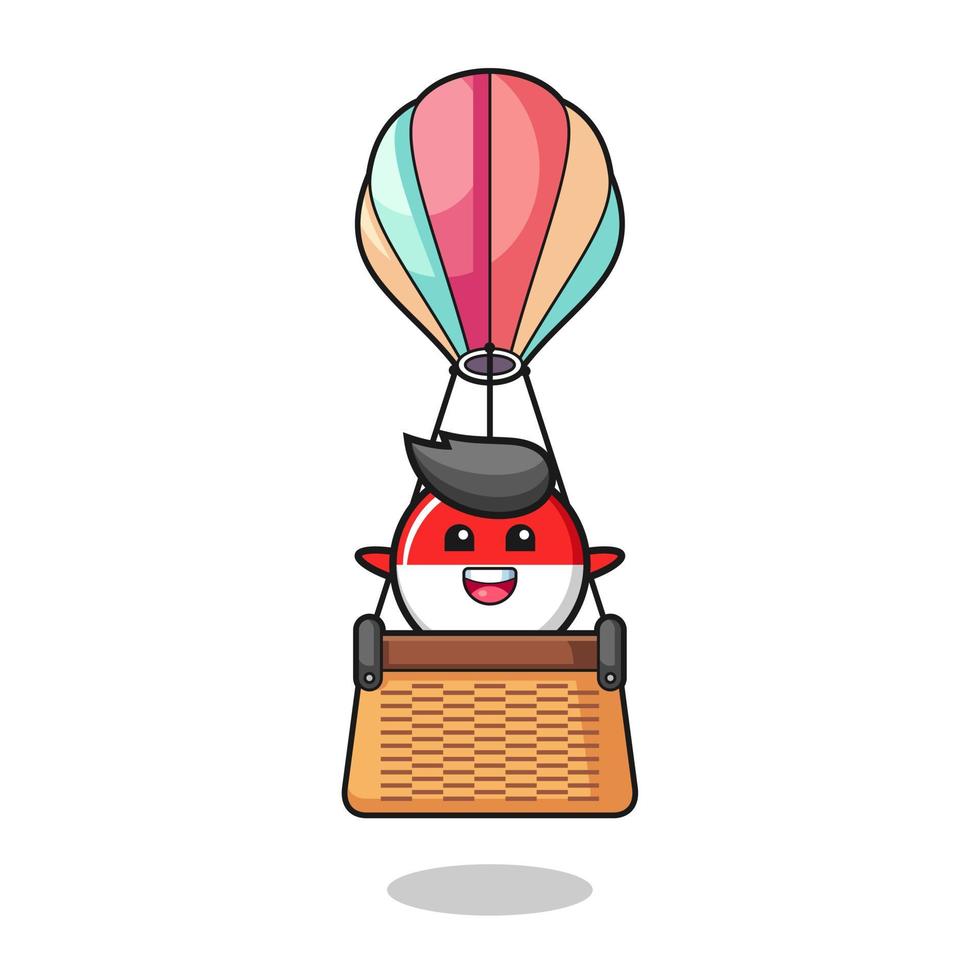 mascotte du drapeau indonésien chevauchant une montgolfière vecteur