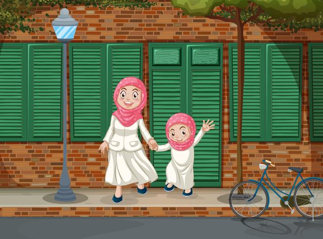Filles musulmanes sur le trottoir vecteur