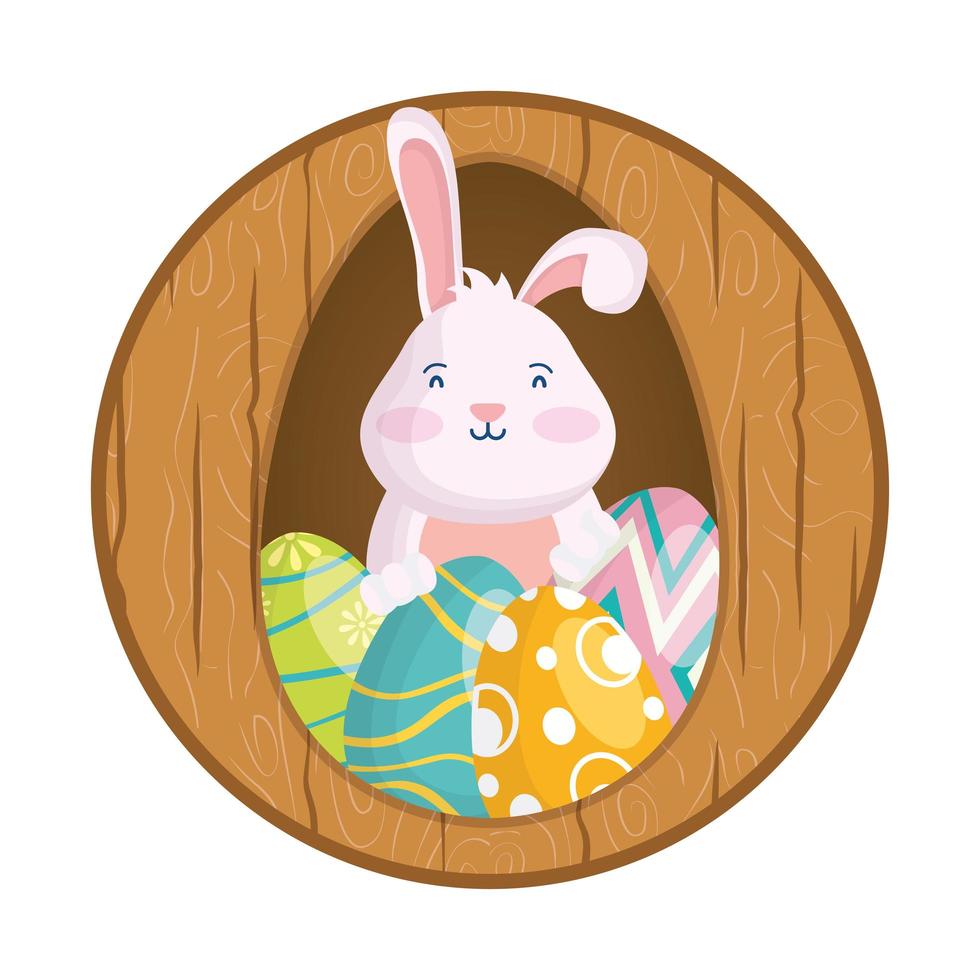Adorable petit lapin de Pâques avec des œufs peints dans un cadre en bois vecteur