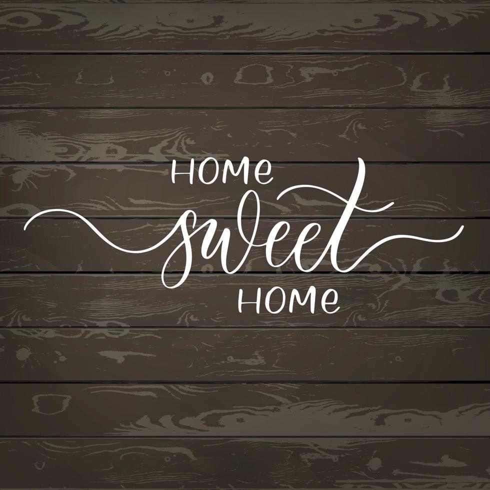 home sweet home - inscription de lettrage à la main sur fond de bois. vecteur