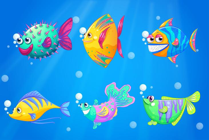 Un océan avec un groupe de poissons colorés vecteur