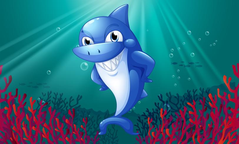 Un requin bleu souriant sous la mer vecteur