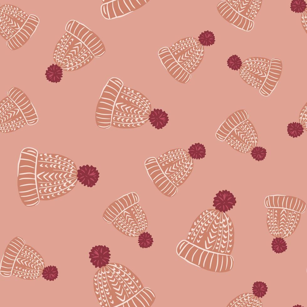 motif aléatoire sans couture avec des formes chaudes de bonnet tricoté. oeuvre de palette rose. vecteur