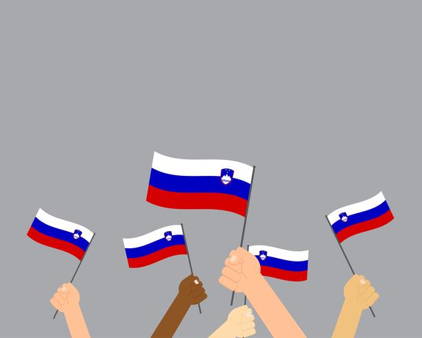 Illustration vectorielle des mains tenant des drapeaux de la Slovénie isolés sur fond gris vecteur