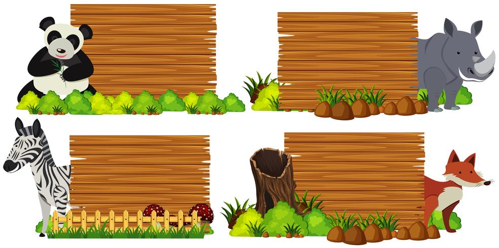 Quatre planches de bois avec des animaux vecteur