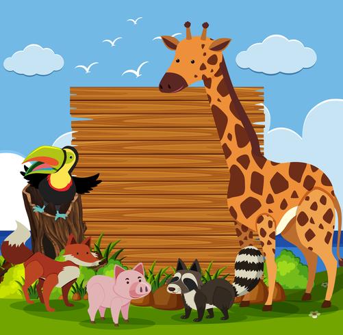 Modèle de planche de bois avec des animaux sauvages dans le jardin vecteur