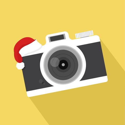 Appareil photo plat vintage avec un chapeau de Noël vecteur