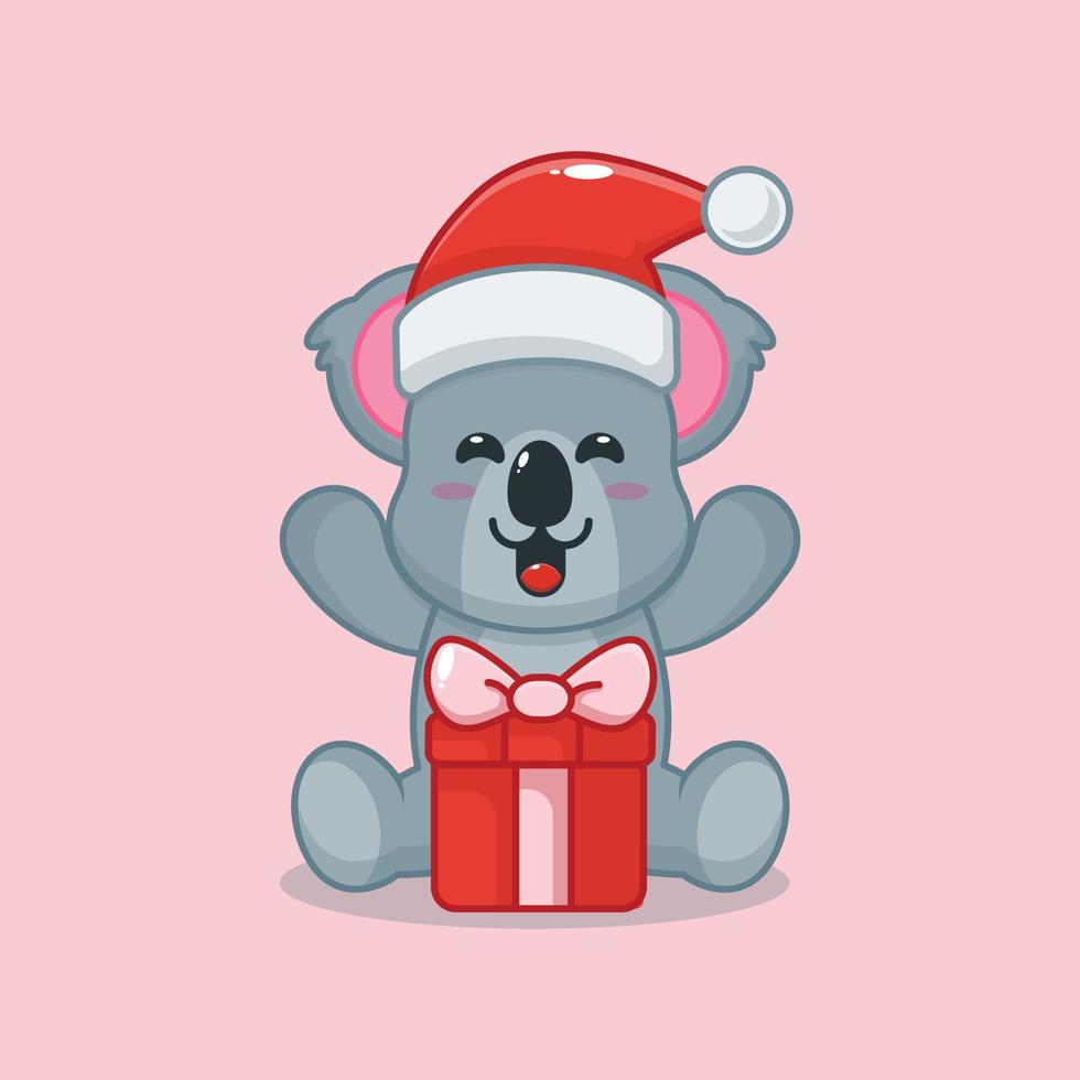 koala mignon heureux avec un cadeau de noël vecteur