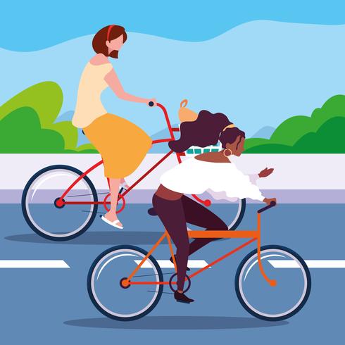 deux femmes à vélo sur la route vecteur