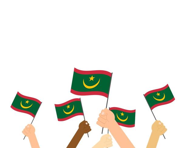 Mains tenant des drapeaux mauritaniens vecteur