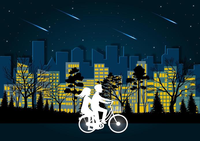 Les hommes et les femmes font du vélo sur la route la nuit vecteur