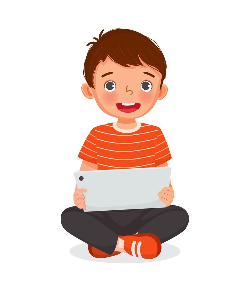 mignon petit garçon assis sur le sol à l'aide d'une tablette numérique touchant l'écran naviguant sur Internet, faisant ses devoirs et jouant à des jeux. enfants et concept de gadgets électroniques pour enfants vecteur