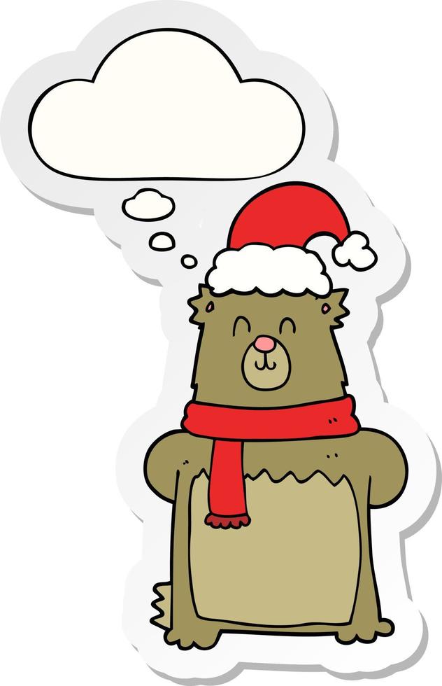 ours en dessin animé portant un chapeau de noël et une bulle de pensée sous forme d'autocollant imprimé vecteur