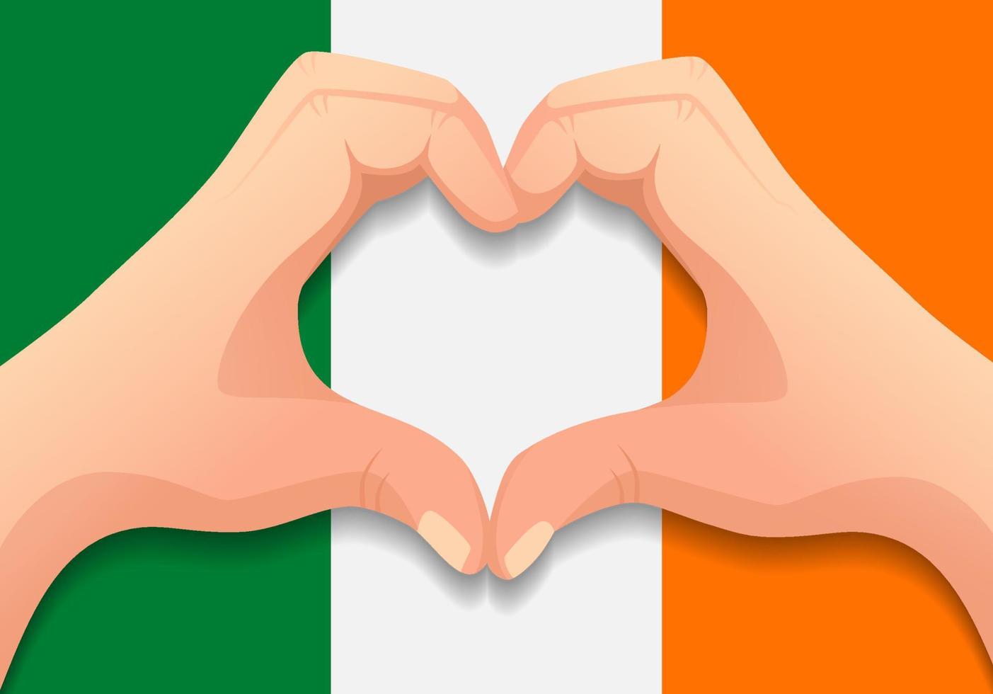 drapeau irlandais et forme de coeur à la main vecteur