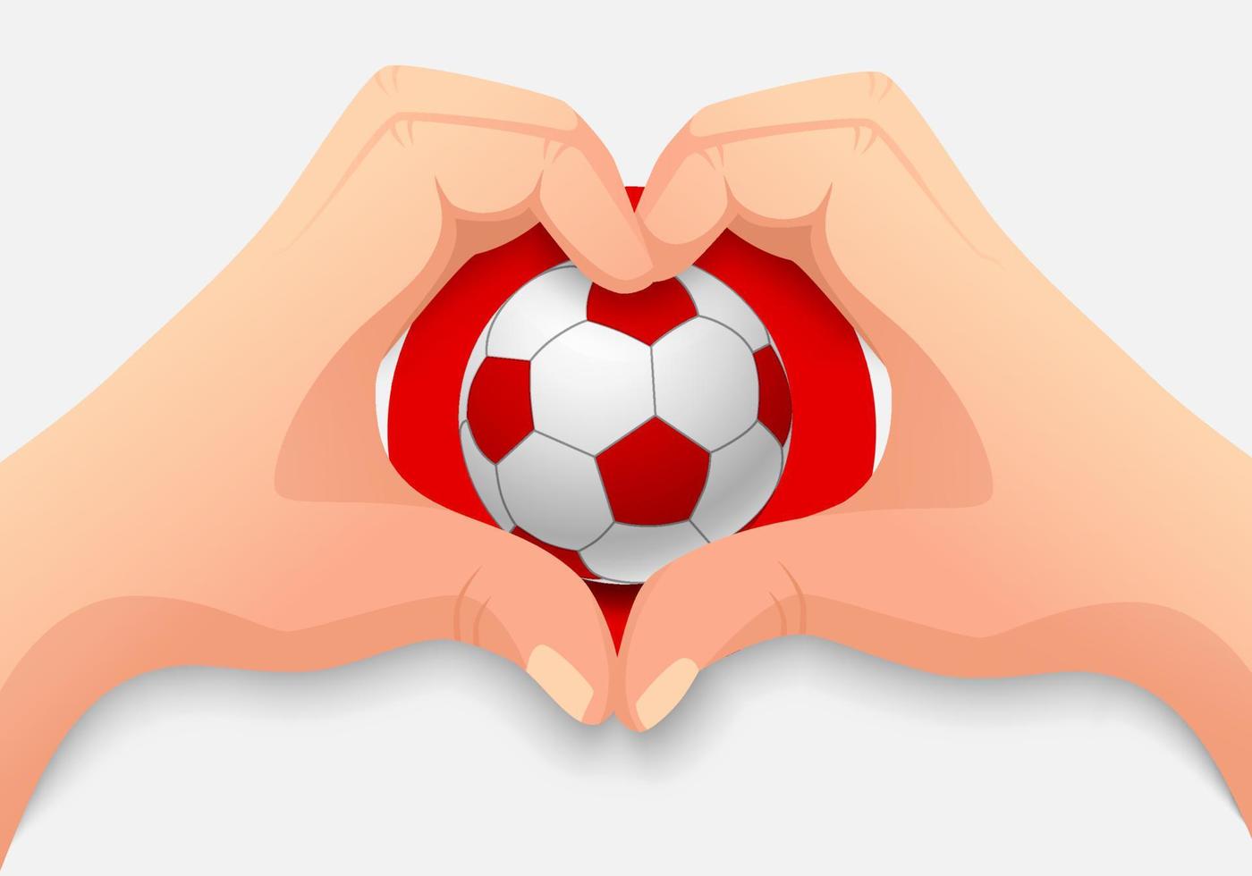 ballon de football du japon et forme de coeur de main vecteur
