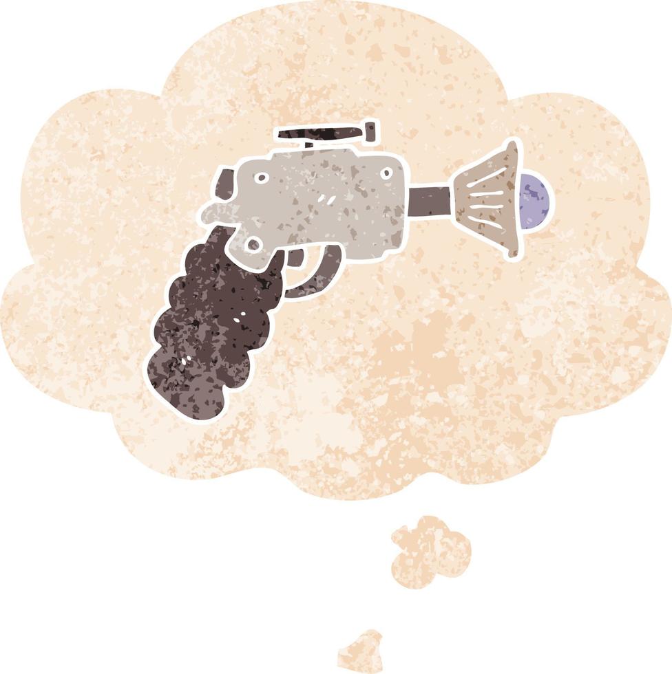 pistolet à rayons de dessin animé et bulle de pensée dans un style texturé rétro vecteur