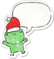 grenouille de dessin animé mignon portant un chapeau de noël et un autocollant en détresse avec bulle de dialogue vecteur