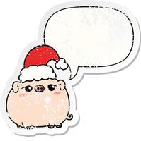 cochon de dessin animé portant un chapeau de noël et un autocollant en détresse avec bulle de dialogue vecteur