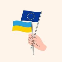 main de dessin animé tenant des drapeaux de l'union européenne et ukrainiens. relations UE Ukraine. concept de diplomatie, de politique et de négociations démocratiques. l'ukraine en tant que nation indépendante et candidate membre de l'ue vecteur