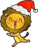 heureux dessin animé texturé d'un lion portant un bonnet de noel vecteur