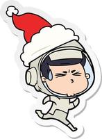 caricature d'autocollant d'un astronaute stressé portant un bonnet de noel vecteur