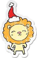 dessin animé autocollant en détresse d'un lion portant un bonnet de noel vecteur