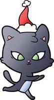joli dessin animé dégradé d'un chat portant un bonnet de noel vecteur