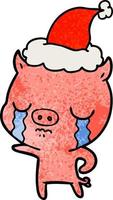 dessin animé texturé d'un cochon pleurant portant un bonnet de noel vecteur