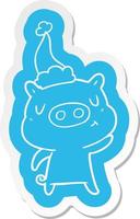 autocollant de dessin animé d'un cochon de contenu portant un bonnet de noel vecteur