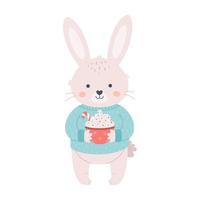 lapin mignon en pull avec une tasse de café ou une boisson de noël. joyeux Noel et bonne année. année du lapin. vecteur