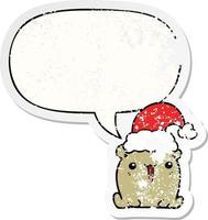 mignon dessin animé ours et chapeau de noël et bulle de dialogue autocollant en détresse vecteur