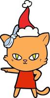 joli dessin au trait d'un chat portant une robe portant un bonnet de noel