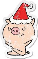 dessin animé autocollant en détresse heureux d'un cochon portant un bonnet de noel vecteur