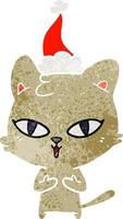 dessin animé rétro d'un chat portant un bonnet de noel vecteur