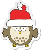 autocollant d'un hibou de dessin animé portant un chapeau de noël vecteur