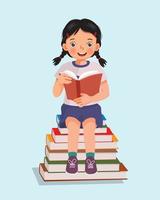 jolie petite étudiante assise sur une pile de livres en train de lire vecteur