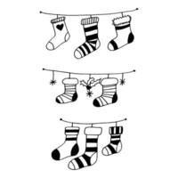 chaussettes pour ensemble de cadeaux de noël. décor suspendu dessiné à la main dans un style doodle vecteur