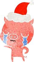 dessin animé rétro d'un cochon qui pleure portant un bonnet de noel vecteur