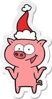 dessin animé autocollant d'un cochon sans soucis portant un bonnet de noel vecteur