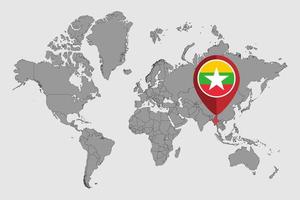 épinglez la carte avec le drapeau du myanmar sur la carte du monde. illustration vectorielle. vecteur