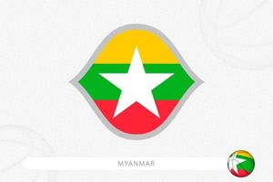 drapeau du myanmar pour la compétition de basket-ball sur fond gris de basket-ball. vecteur